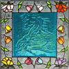 Embossed Horse: 9"x9" stained glass floral border panel with a colored glass piece of an embossed horse in the center.