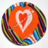 Combed Heart Plate:
7" fused glass plate. Strips of glass and glass circles layered into a round ring, then combed, flattened and formed into a plate.