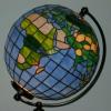 World Globe (13" diameter). It is illuminated and partially rotates. The landmass colors represents the climate zones.