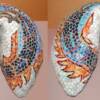 Dragon fortune cookie (18"x18"x10"). Top and bottom views. Stained glass on concrete, sytrofoam & fiberglass substrate.