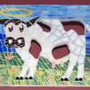 Holy Cow: 9"x13" stained glass on plywood. The black spots on the dairy cow were cut out with a jigsaw. So, this is also a "holey" cow.